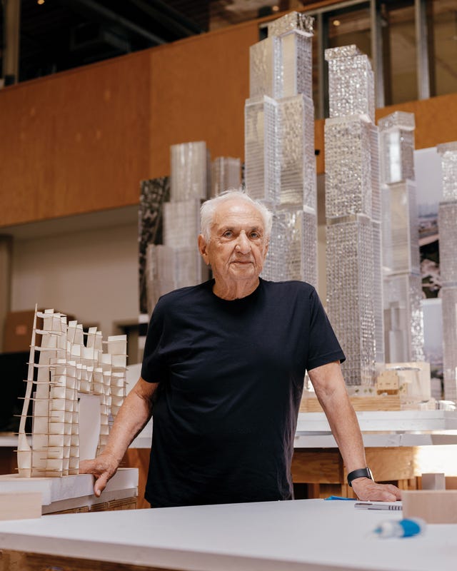 exterior of frank gehry’s santa monica home, featuring corrugated metal, exposed plywood, and chain link fencing—an iconic example of deconstructivist architecture.