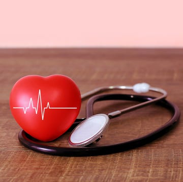 Stethoscope and heart examination red on old wooden floor health care concept stethoscope and heart examination red on old wooden floor health care concept