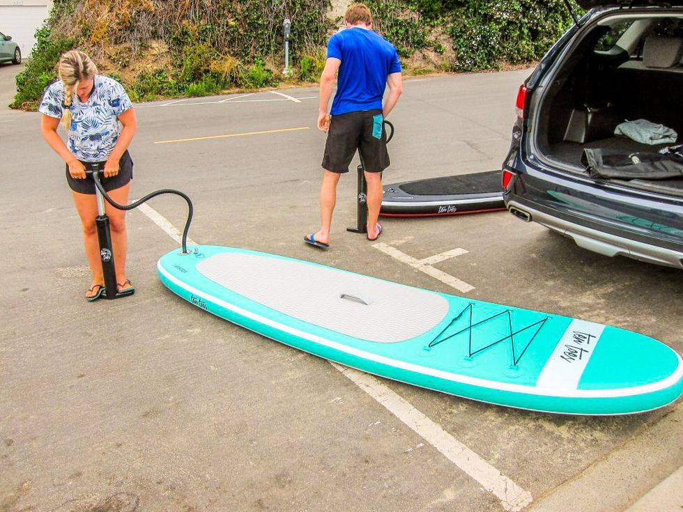 inflating a standup paddleboard