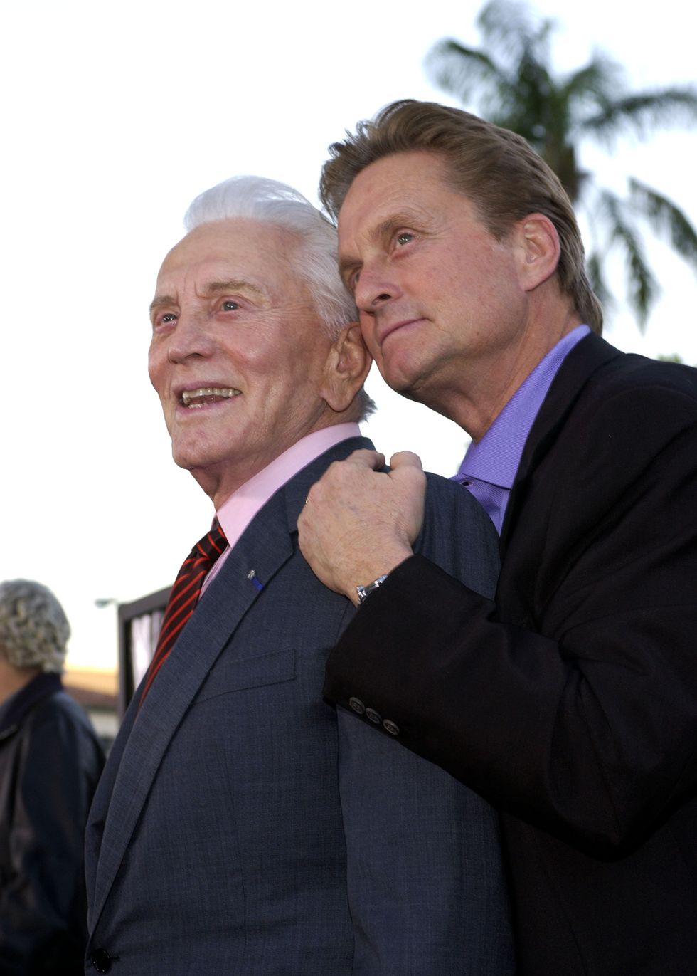Kirk Douglas: Douglas and his younger 'twin,' Michael, have a father-son moment during the It Runs in the Family premiere in Westwood, California, in 2003. (Photo: WireImage)