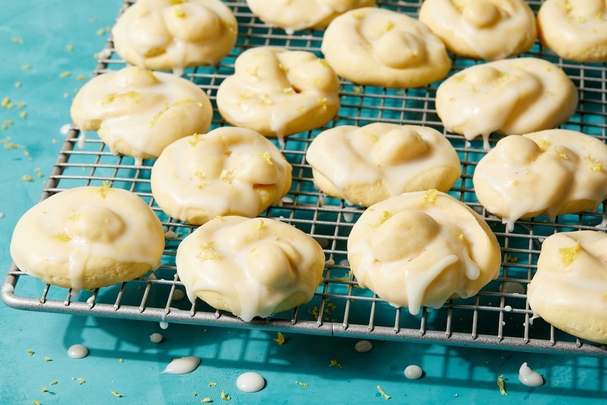 italian lemon cookies covered in an white icing glaze and lemon zest