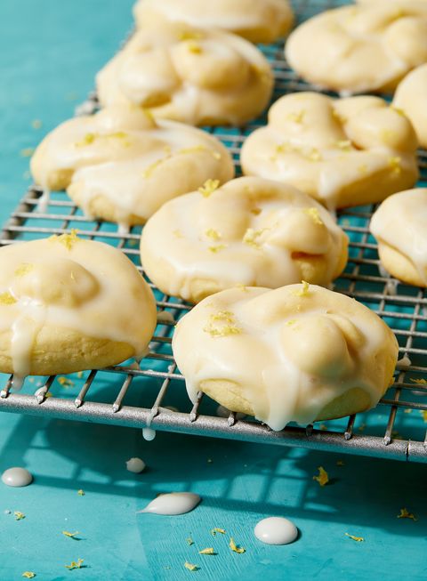 italian lemon cookies covered in an white icing glaze and lemon zest