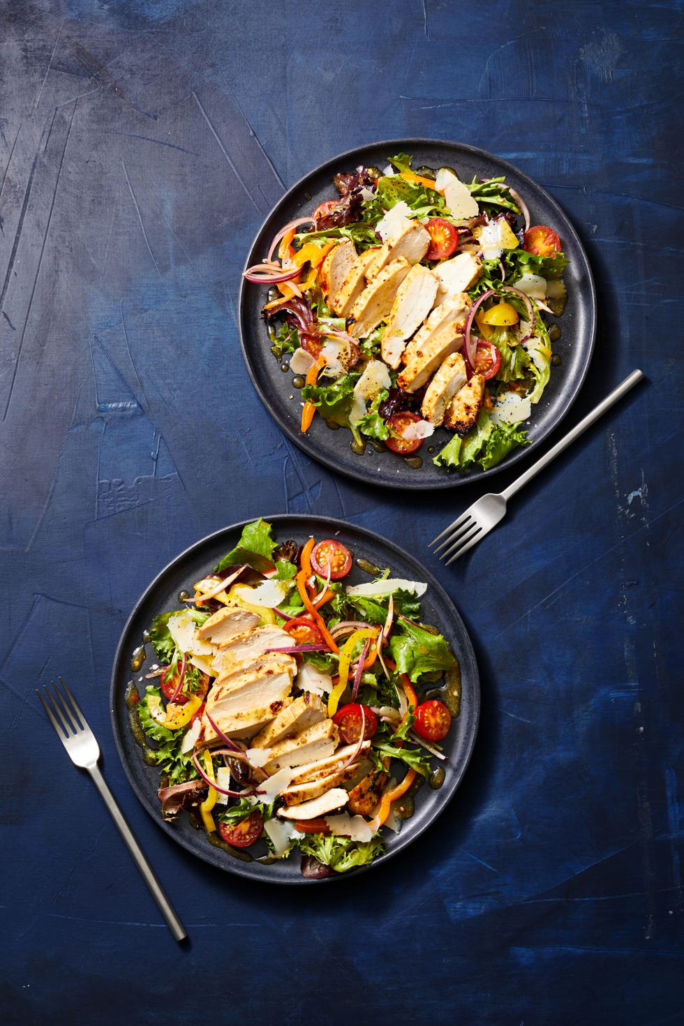 italian marinated chicken breast over a garden salad