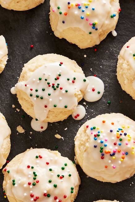 italian ricotta cookies topped with icing glaze and non pareil sprinkles