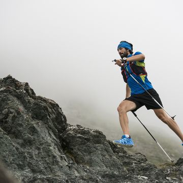 italy, alagna, trail runner on the move near monte rosa mountain massif