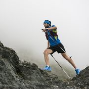 italy, alagna, trail runner on the move near monte rosa mountain massif