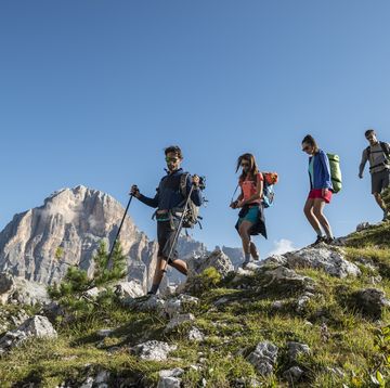 italy, friends trekking in the dolomtes