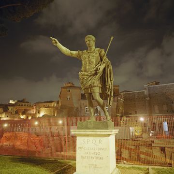 italy, rome, statue of augustus at night