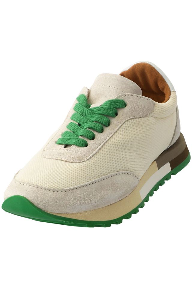 a white and green tennis shoe