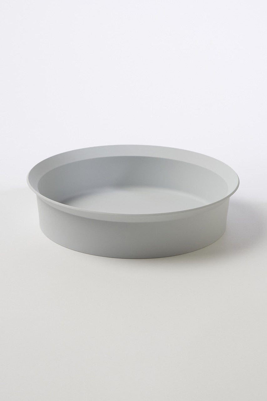 a white plate on a white surface