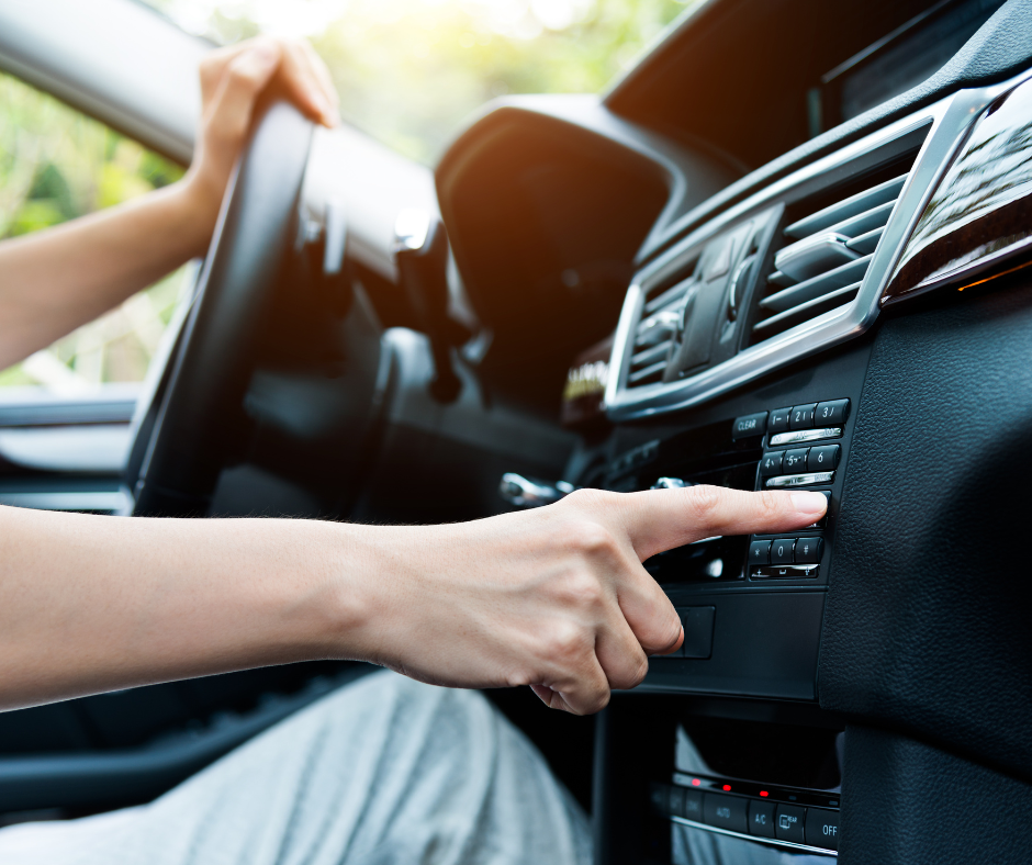 car dashboard controls being adjusted