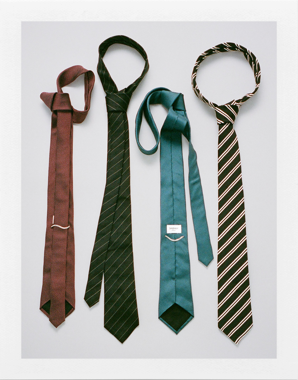 four neckties arranged in an overlapping pattern