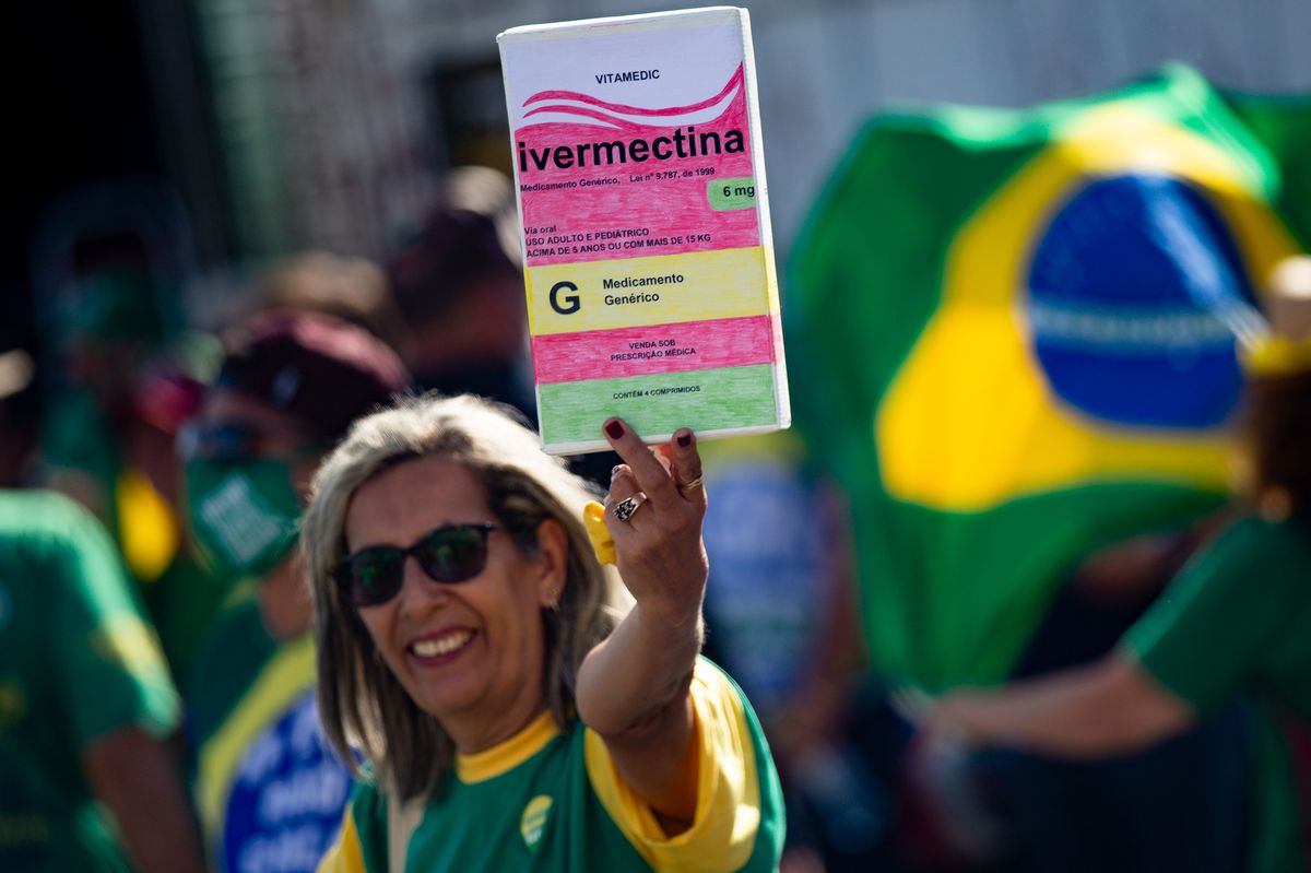 brasilia, brazil   may 15 protester with a poster of a box of ivermectin, used by many people to combat covid 19, during protest organized to show suppor to bolsonaro's government at esplanada dos ministérios on may 15, 2021 in brasilia, brazil photo by andressa anholetegetty images