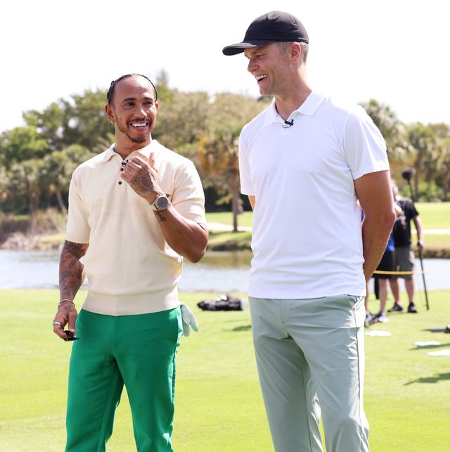 miami beach, florida   may 04 iwc brand ambassador and seven time formula one world champion lewis hamilton and iwc brand ambassador and seven time world champion quarterback tom brady during the big pilot challenge, an entertaining charity golf challenge organized by iwc schaffhausen at the miami beach golf club on may 4, 2022 in miami beach, florida photo by alexander tamargogetty images for iwc schaffhausen