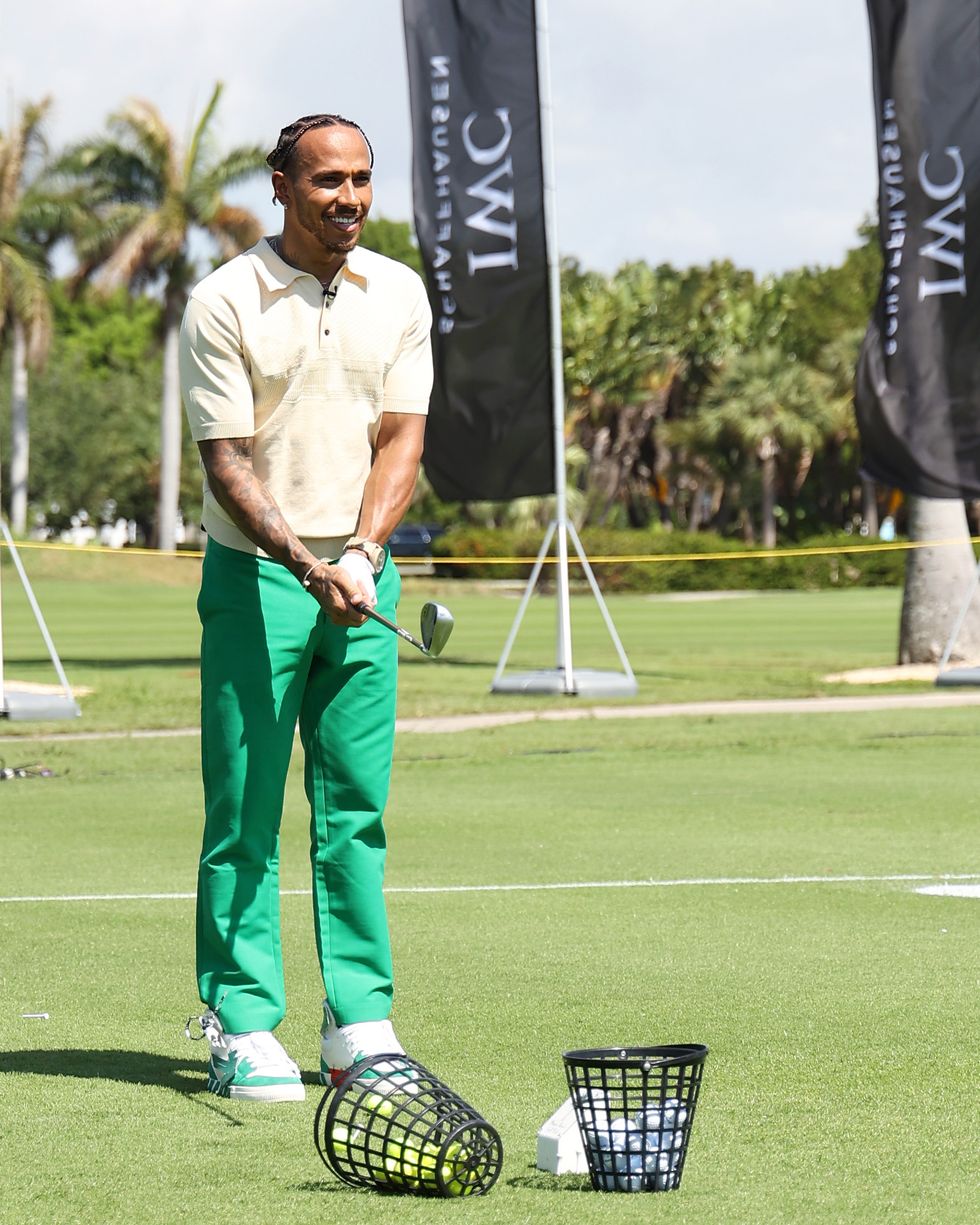 miami beach, florida   may 04 iwc brand ambassador and seven time formula one world champion lewis hamilton during the big pilot challenge, an entertaining charity golf challenge organized by iwc schaffhausen at the miami beach golf club on may 4, 2022 in miami beach, florida photo by john parragetty images for iwc schaffhausen