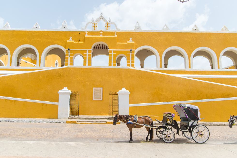 izamal is an old town in yucatan it's main characteristic is that every house and building is painted yellow