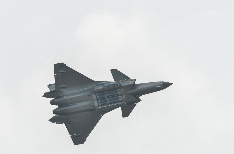 chengdu j 20 fighter with weapons bay open showing air to air missiles inside