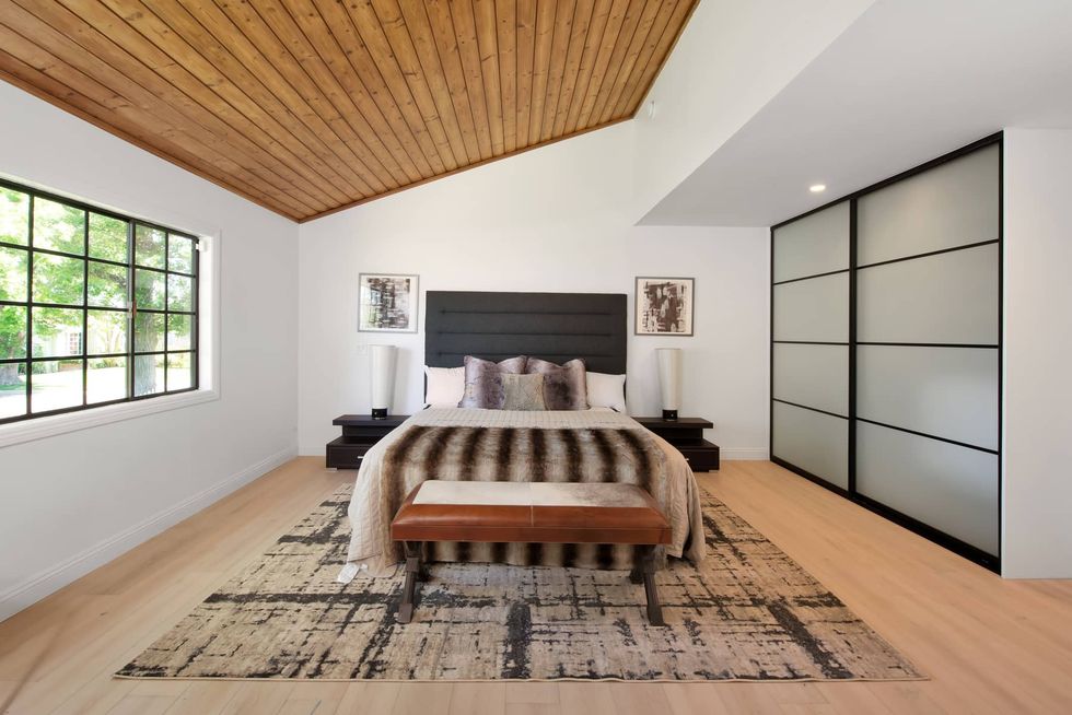main bedroom with wood ceiling