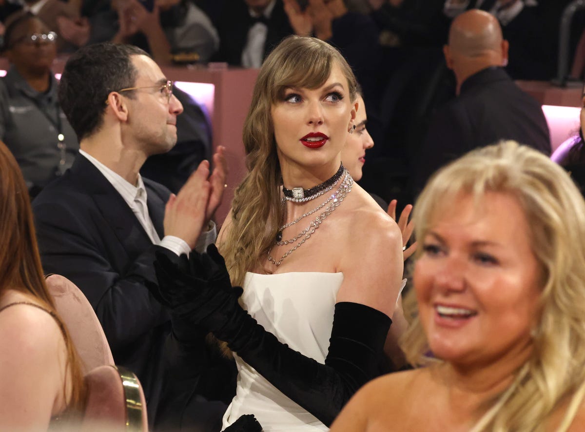 Watch Taylor Swift Plan Midnight Easter Egg on Grammys Red Carpet