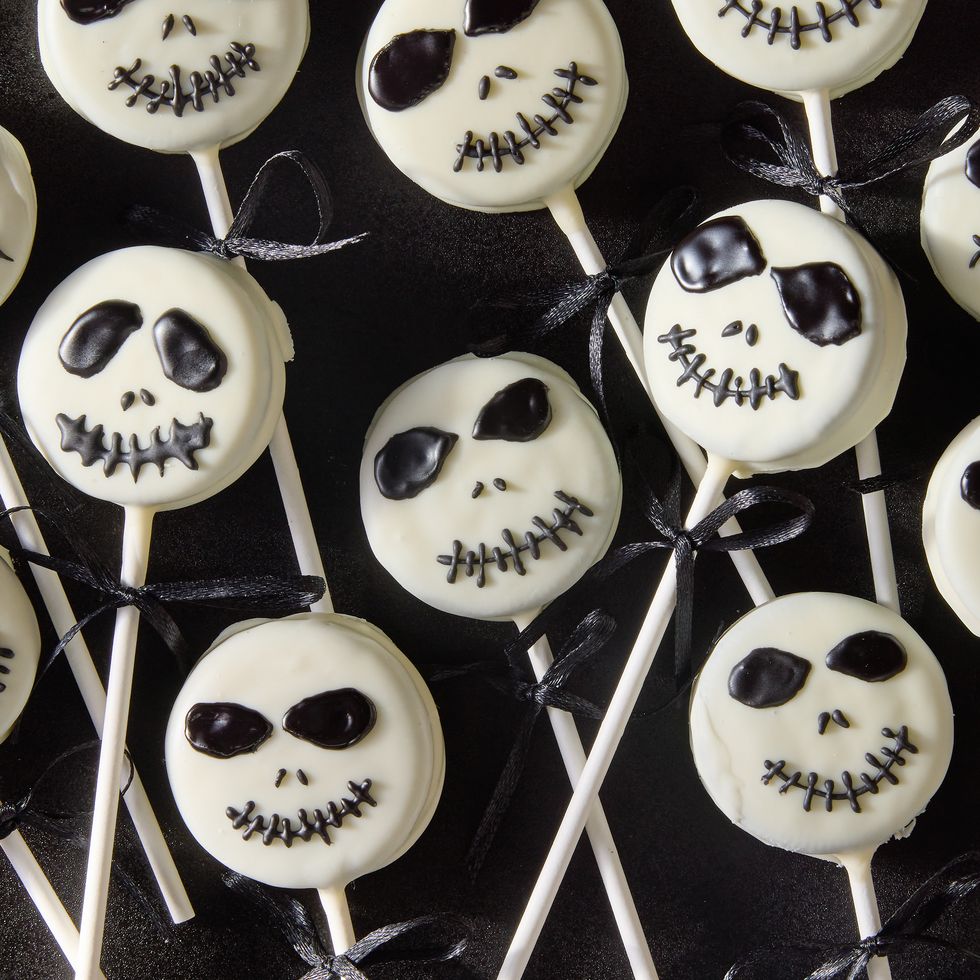 white chocolate covered oreo pops decorated as jack skellington with icing