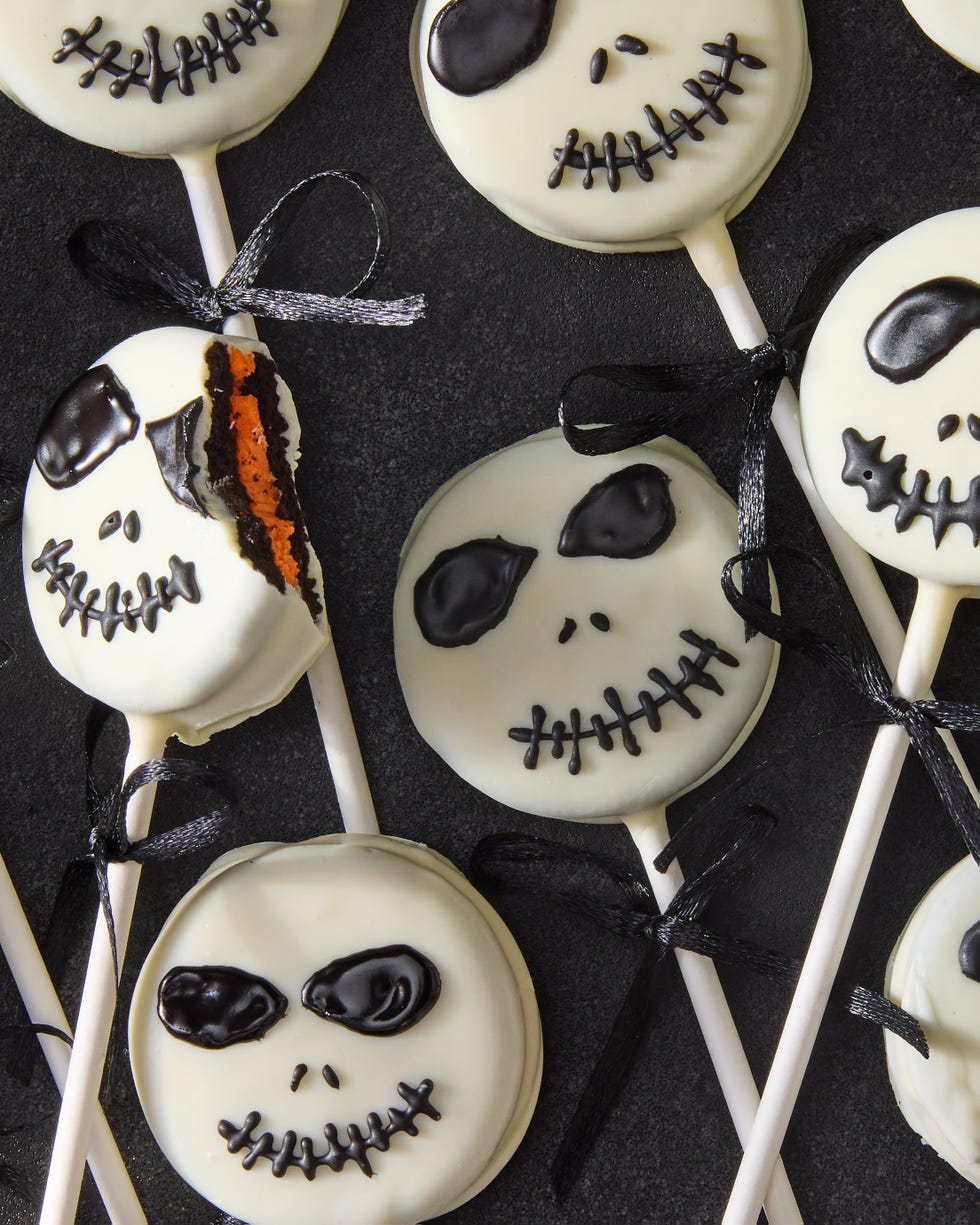 white chocolate covered oreo pops decorated as jack skellington with icing