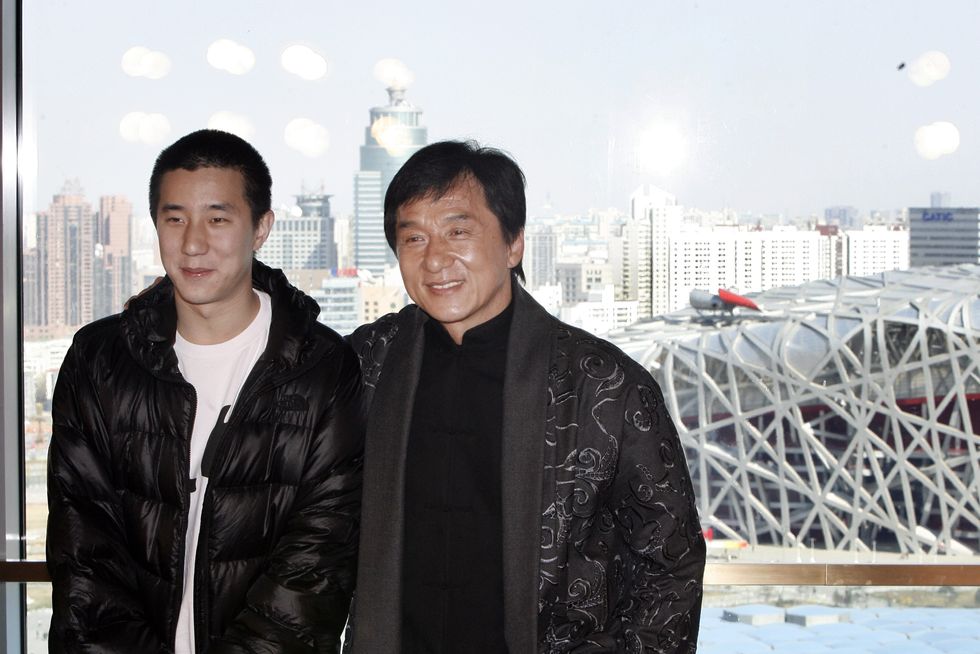 jackie chan and his son jaycee chan standing next to each other