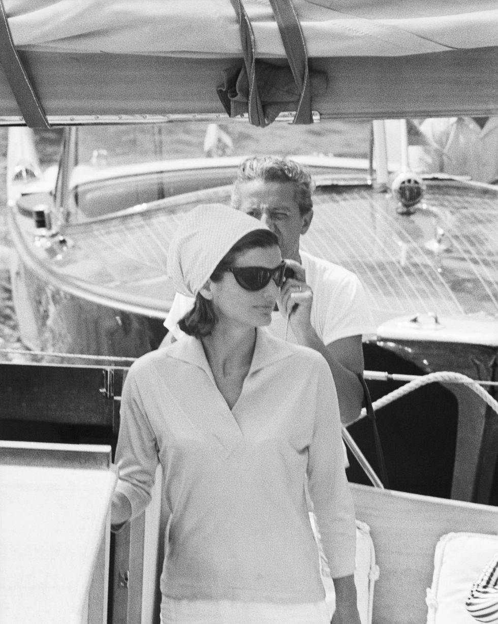 jackie kennedy standing in prow of boat