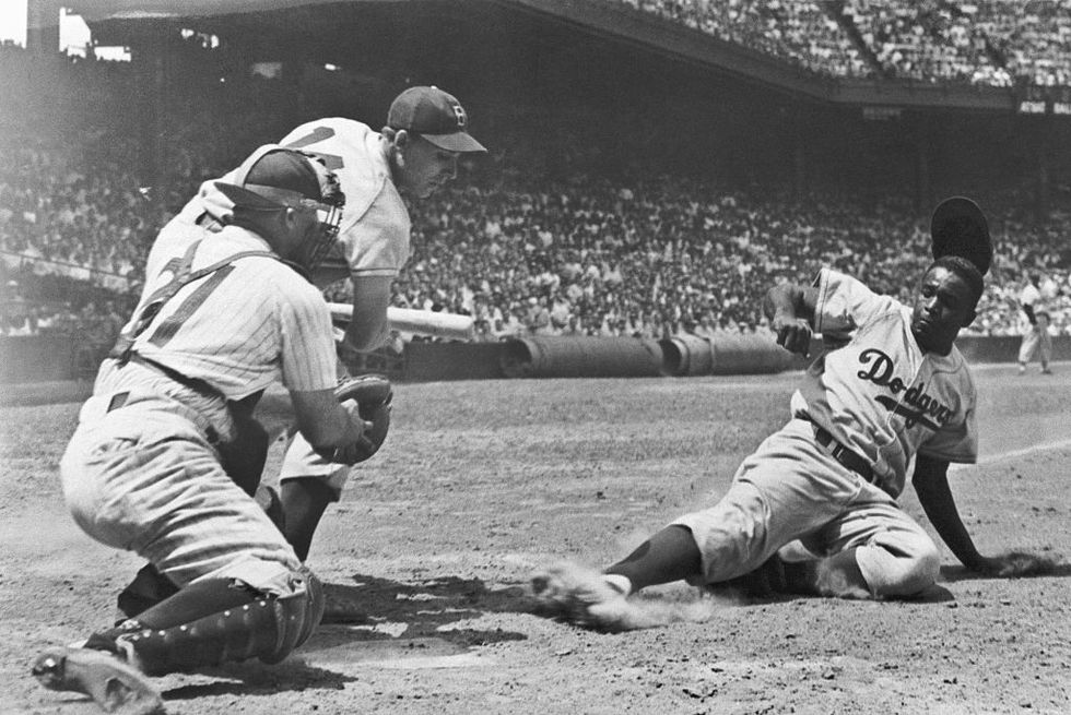jackie robinson steals and slides into home
