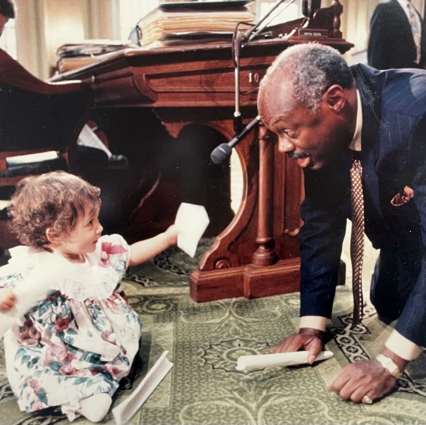 speier's toddler daughter playing on the floor with willie brown