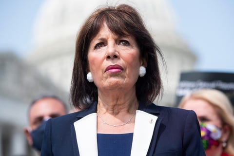 jackie speier dressed in a blue and white suit standing outside the capitol