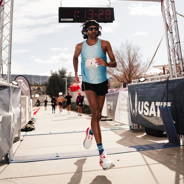 runner crossing the finish line at a race event