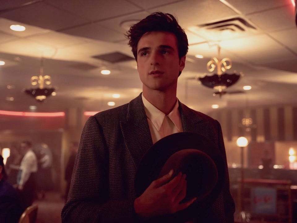 person holding a hat in a retrothemed venue