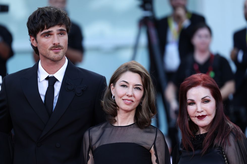 jacob elordi standing for a photo with sofia coppola and priscilla presley