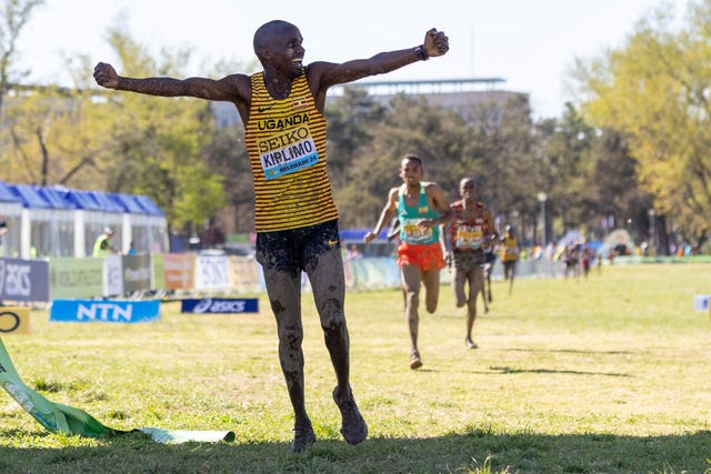 belgrade, serbia march 30 jacob kiplimo of uganda celebrates whilst crossing the finish line to win in the senior mens final during the world athletics cross country finals championships at the park of friendship on march 30, 2024 in belgrade, serbia photo by maja hitijgetty images