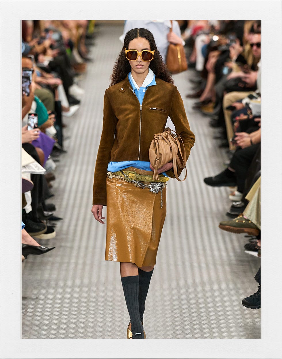 fashion model walking the runway in a stylish outfit