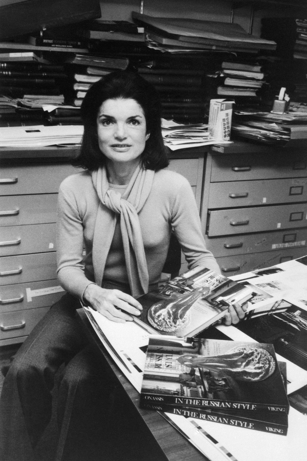 jacqueline kennedy onassis sitting at her editing desk