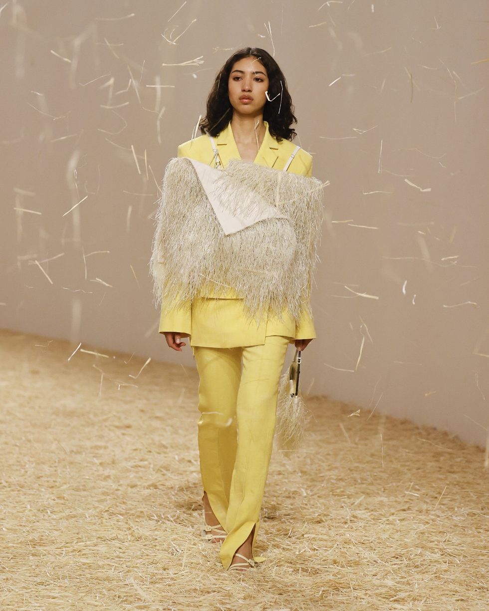 a model wears a jacquemus suit in a roundup of spring 2023 fashion trends worth shopping