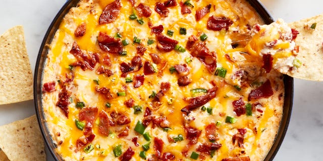 creamy cheese dip topped with bacon and diced jalapeno