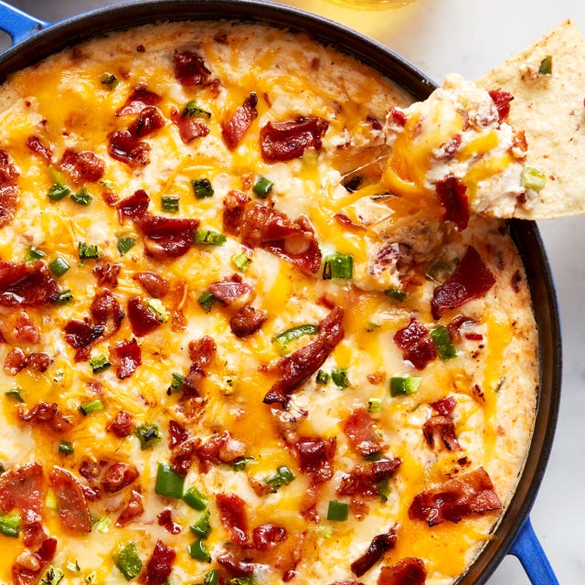 creamy cheese dip topped with bacon and diced jalapeno