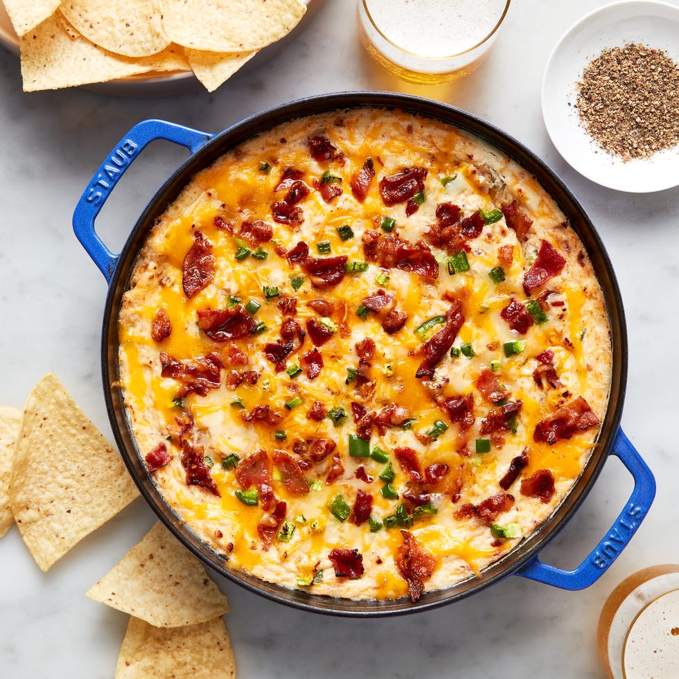 creamy cheese dip topped with bacon and diced jalapeno
