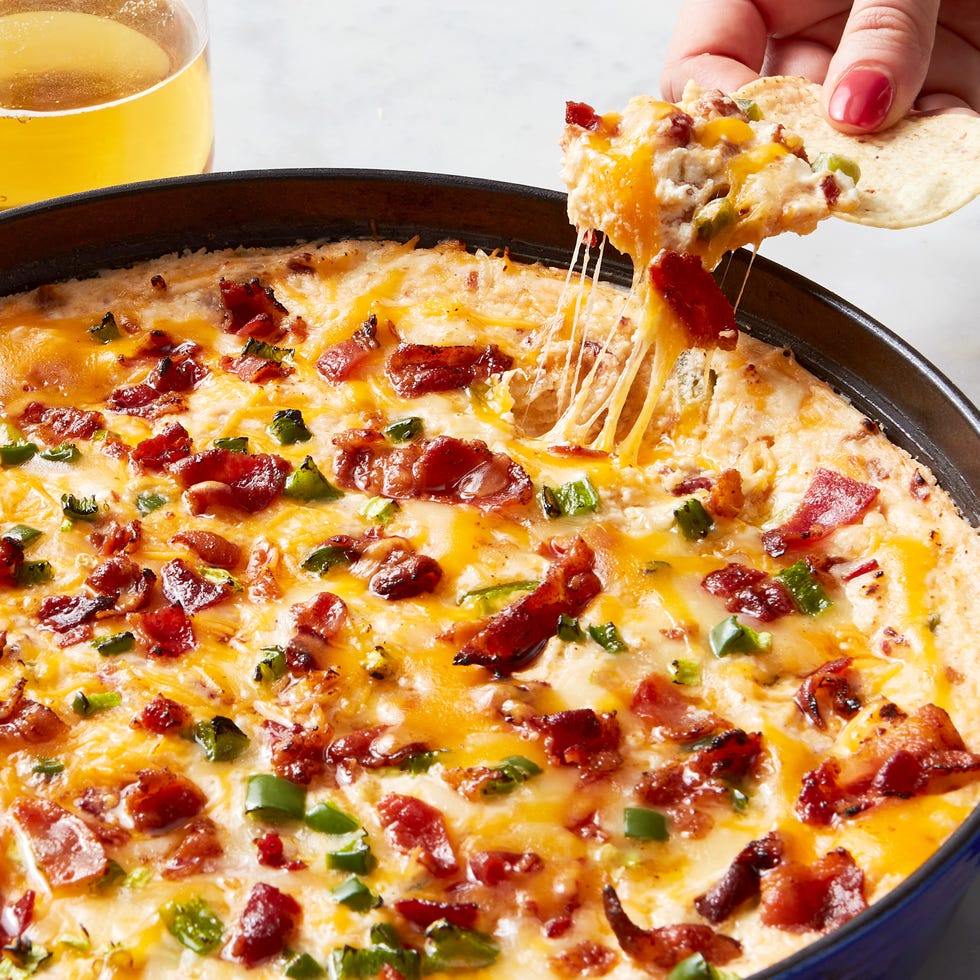 creamy cheese dip topped with bacon and diced jalapeno