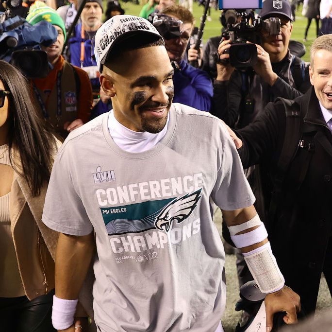 bry burrows and jalen hurts walk off the field after the philadelphia eagles defeat the san francisco 49ers in the nfc championship game