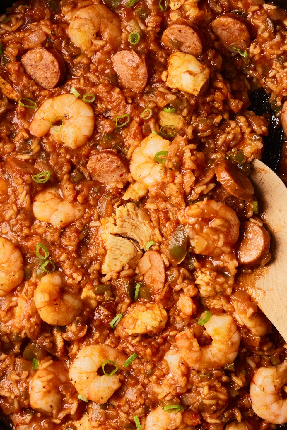 jambalaya with shrimp, chicken, and sausage in a skillet