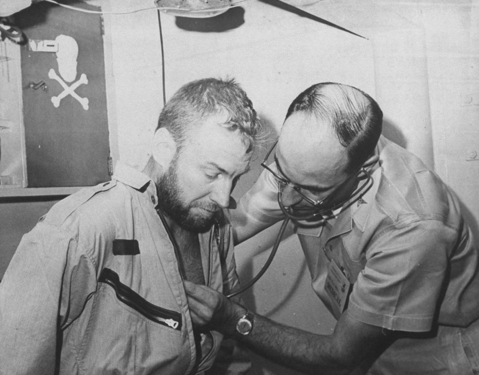 James A. Lovell Jr., undergoing medical tests on USS Wasp after recovery from space capsule of Gemini 7 flight.