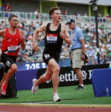 runner on track in steeplechase runner on track in steeplechase