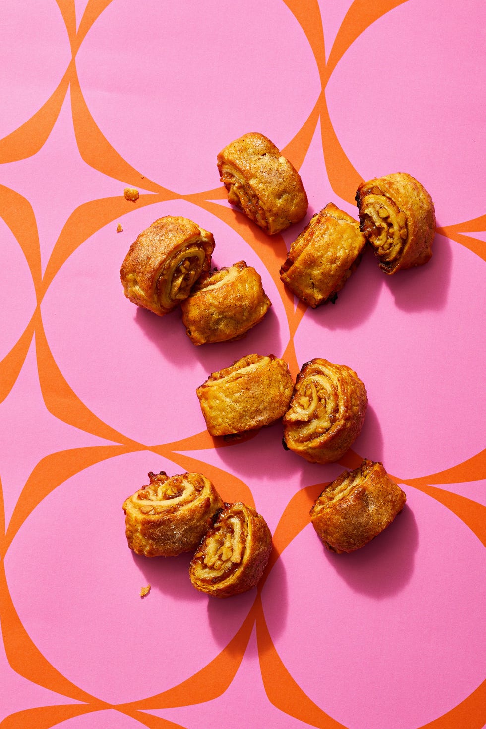 jammy walut rugelach on a pink background