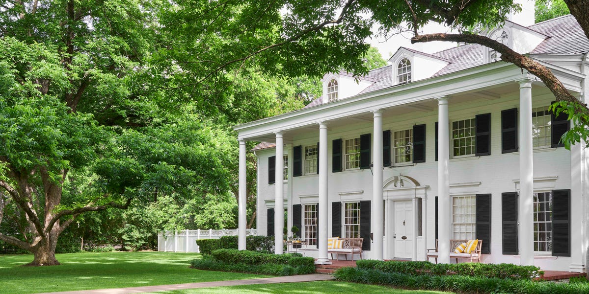 a three story white colonial home was designed by noted architect