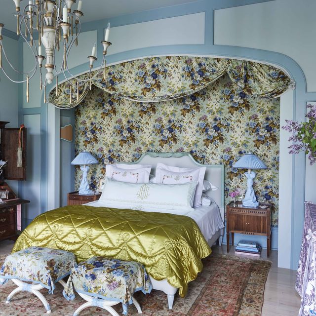a dramatic boudoir where his broad bed niche nearly matched her own alcove and is draped with thirty yards of fabric