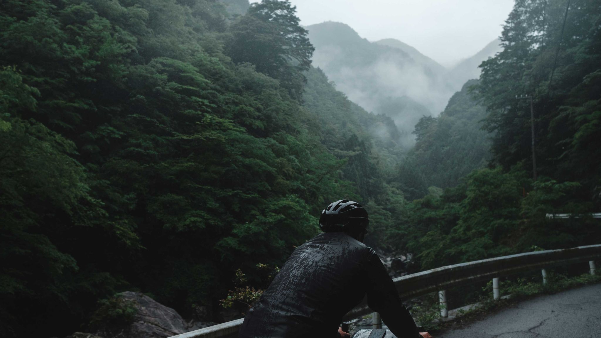 Cyclist in Japan in the rain in the summer of 2018.
