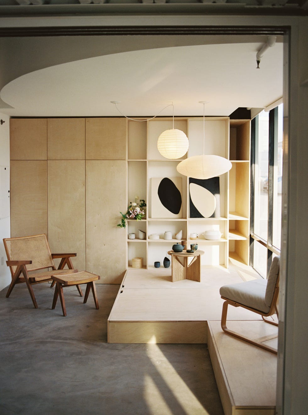 a room with a mirror and chairs